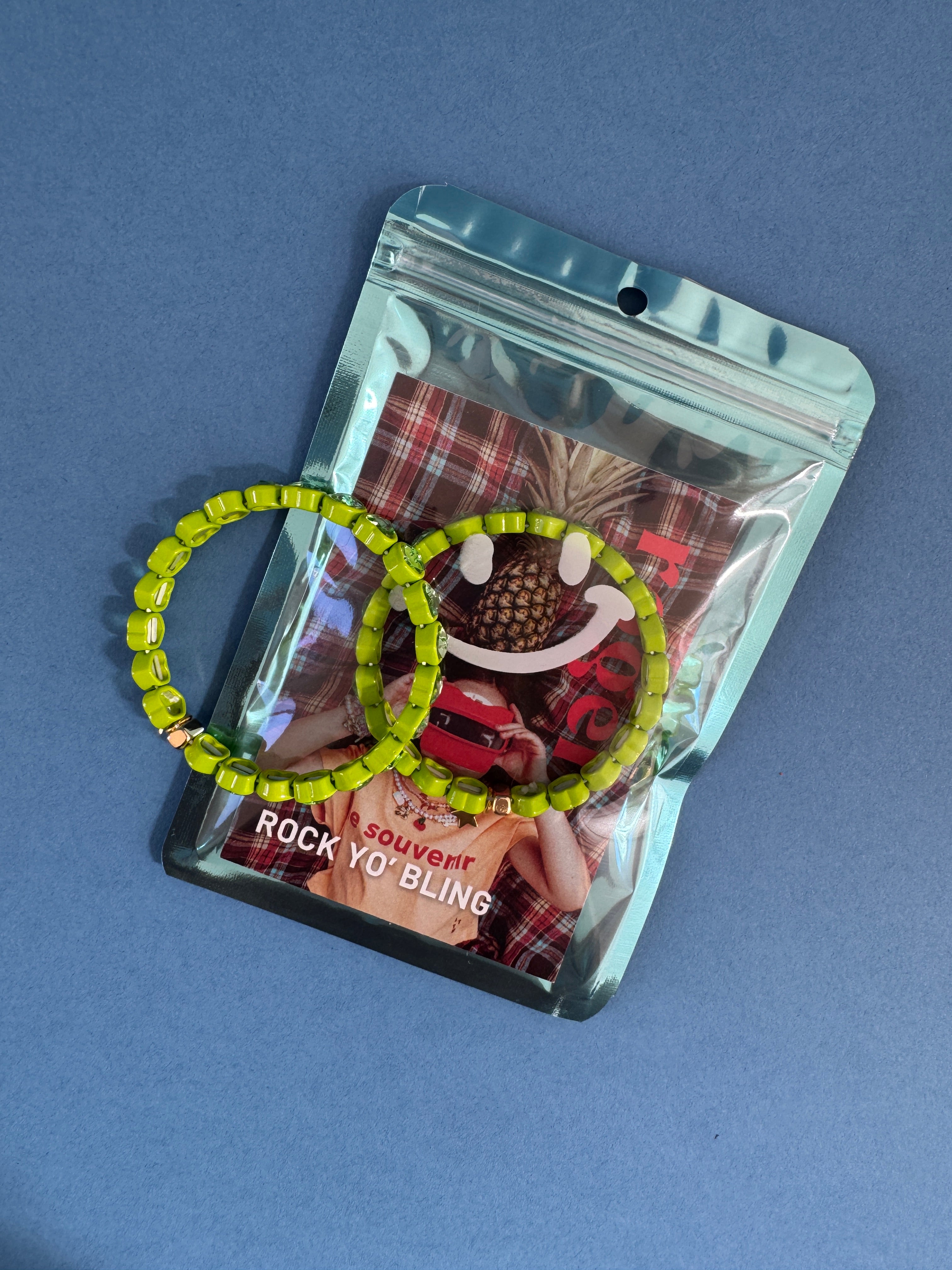 green heart bracelet in packaging