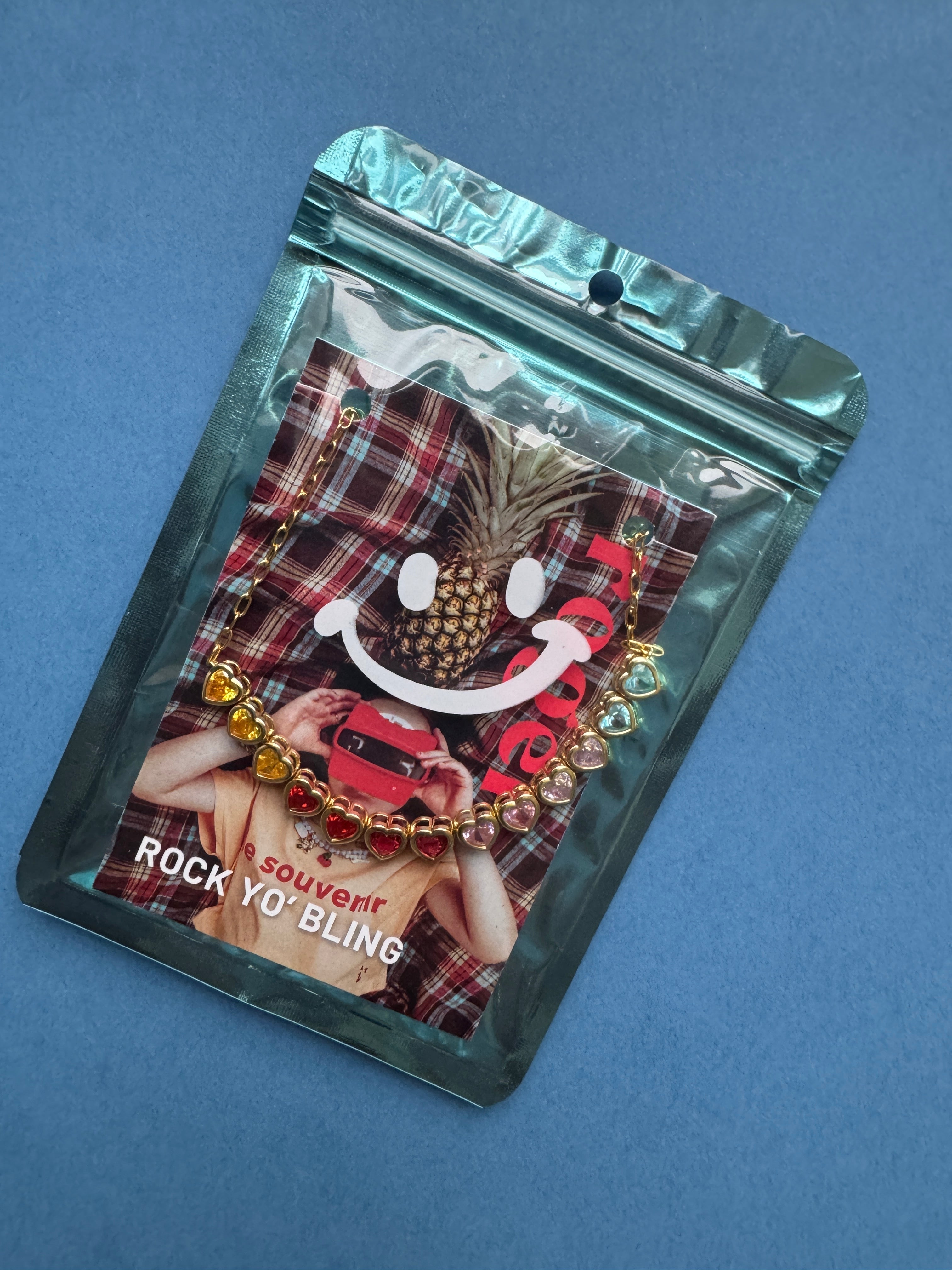 Packaged jewelry set with plaid pattern on a blue background