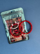 red heart bracelet in packaging