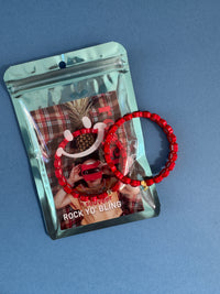 red heart bracelet in packaging
