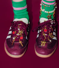 adidias samba shoes up close with sneaker charms.