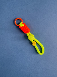 Colorful keychain with a smiley face on a blue background