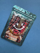 Packaged jewelry set with plaid pattern on a blue background